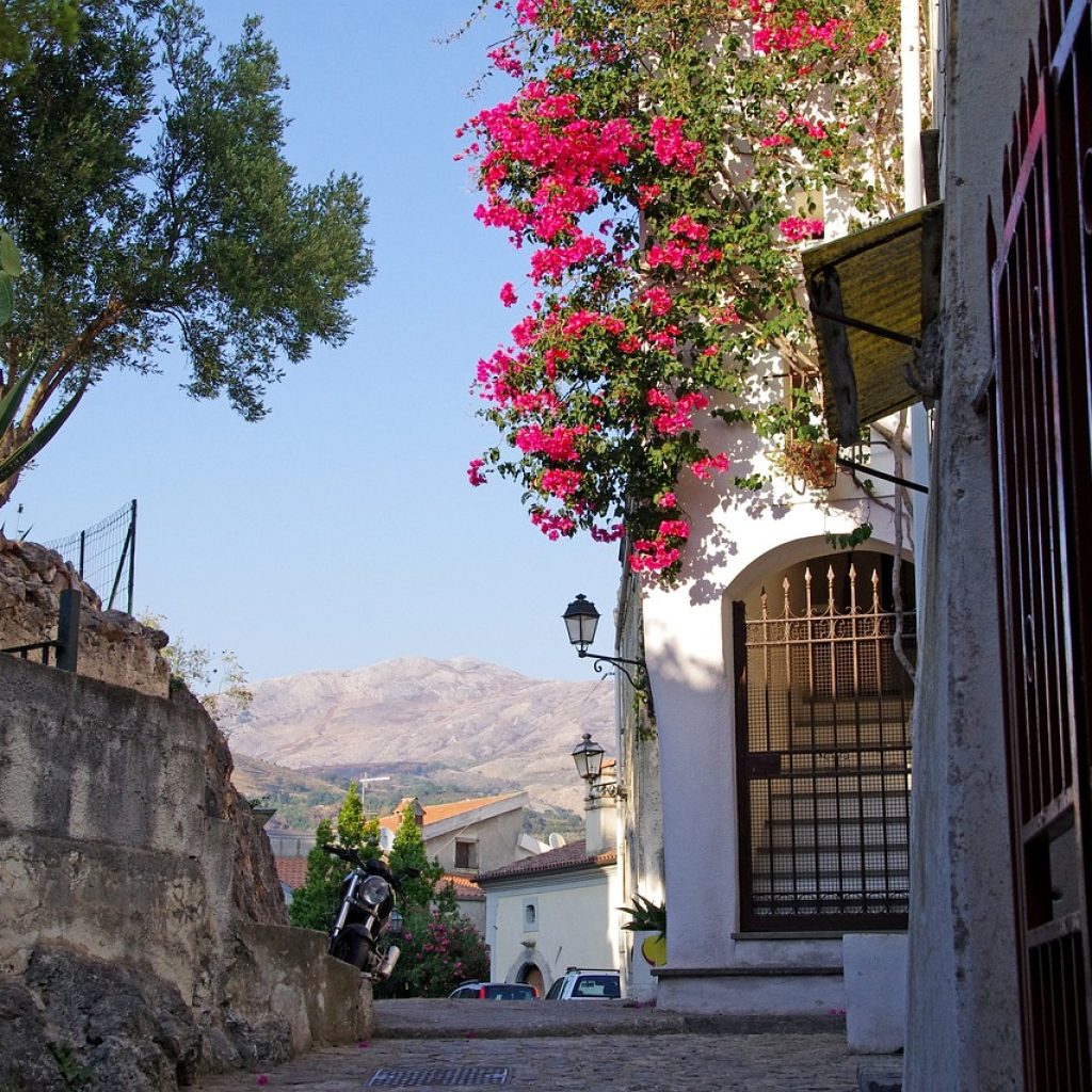 An old house in a charming Italian village, showcasing rustic architecture and historic charm.