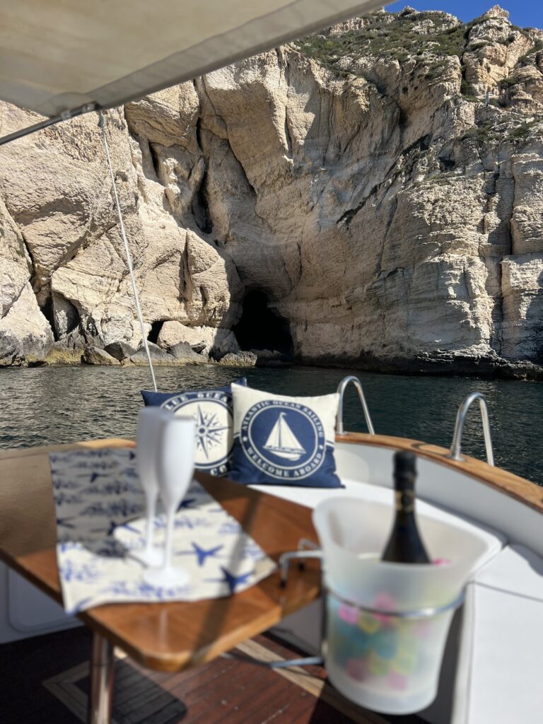 Relax in luxury aboard a private boat, soaking up the sun and the stunning Sardinian views.